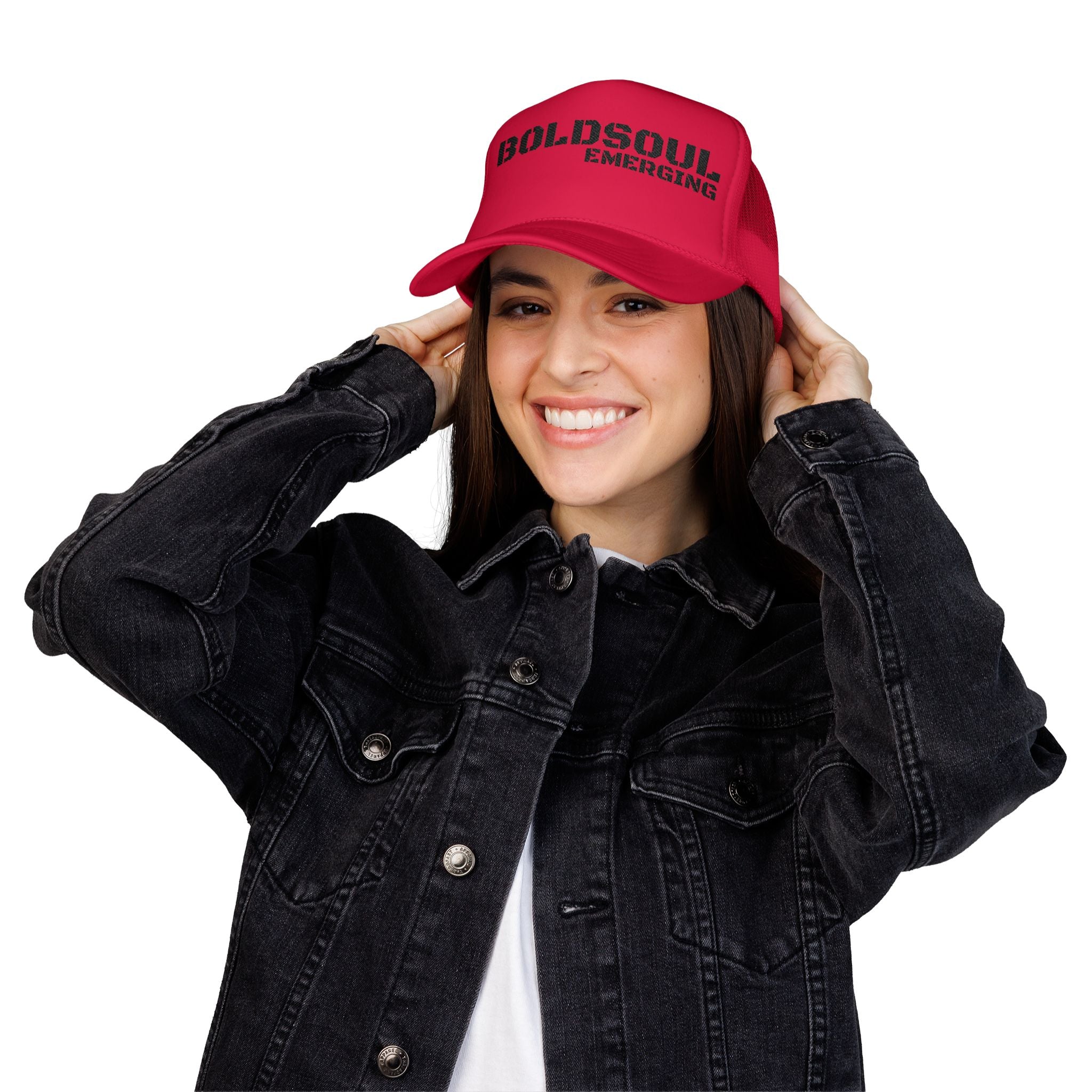 Model wearing BOLDSOUL foam trucker hat in white and hot pink with black text graphic, mesh back, and curved brim