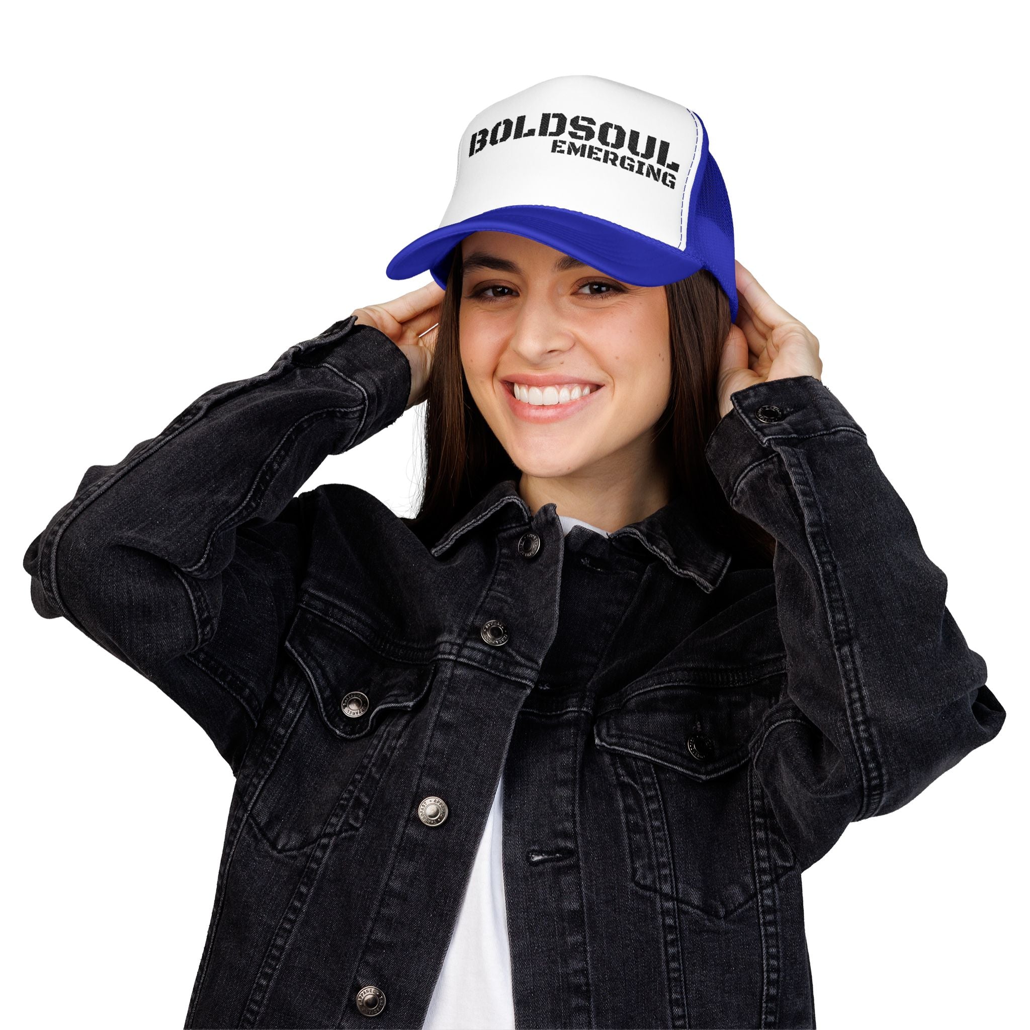 Model wearing BOLDSOUL foam trucker hat in white and hot pink with black text graphic, mesh back, and curved brim