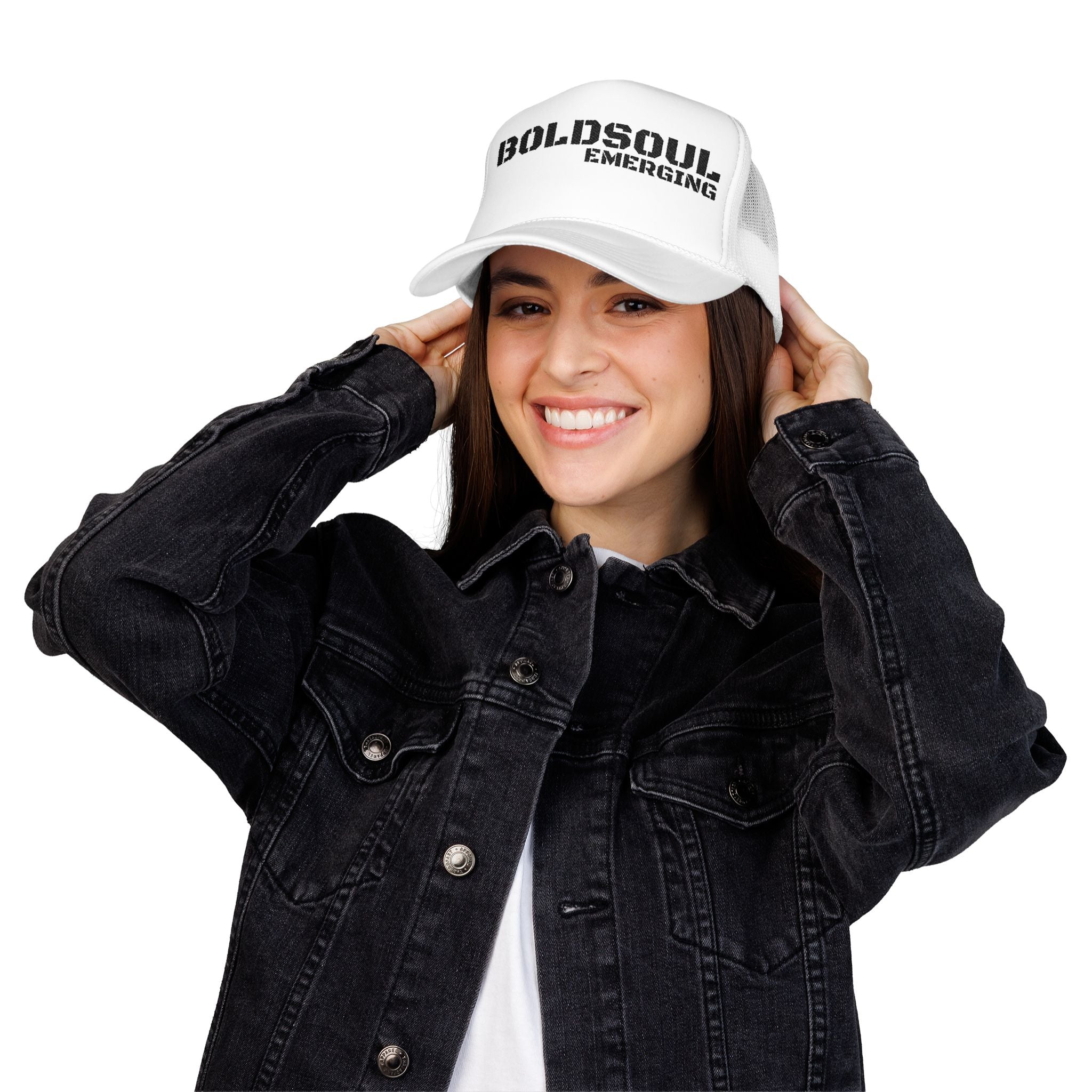 Model wearing BOLDSOUL foam trucker hat in white and hot pink with black text graphic, mesh back, and curved brim