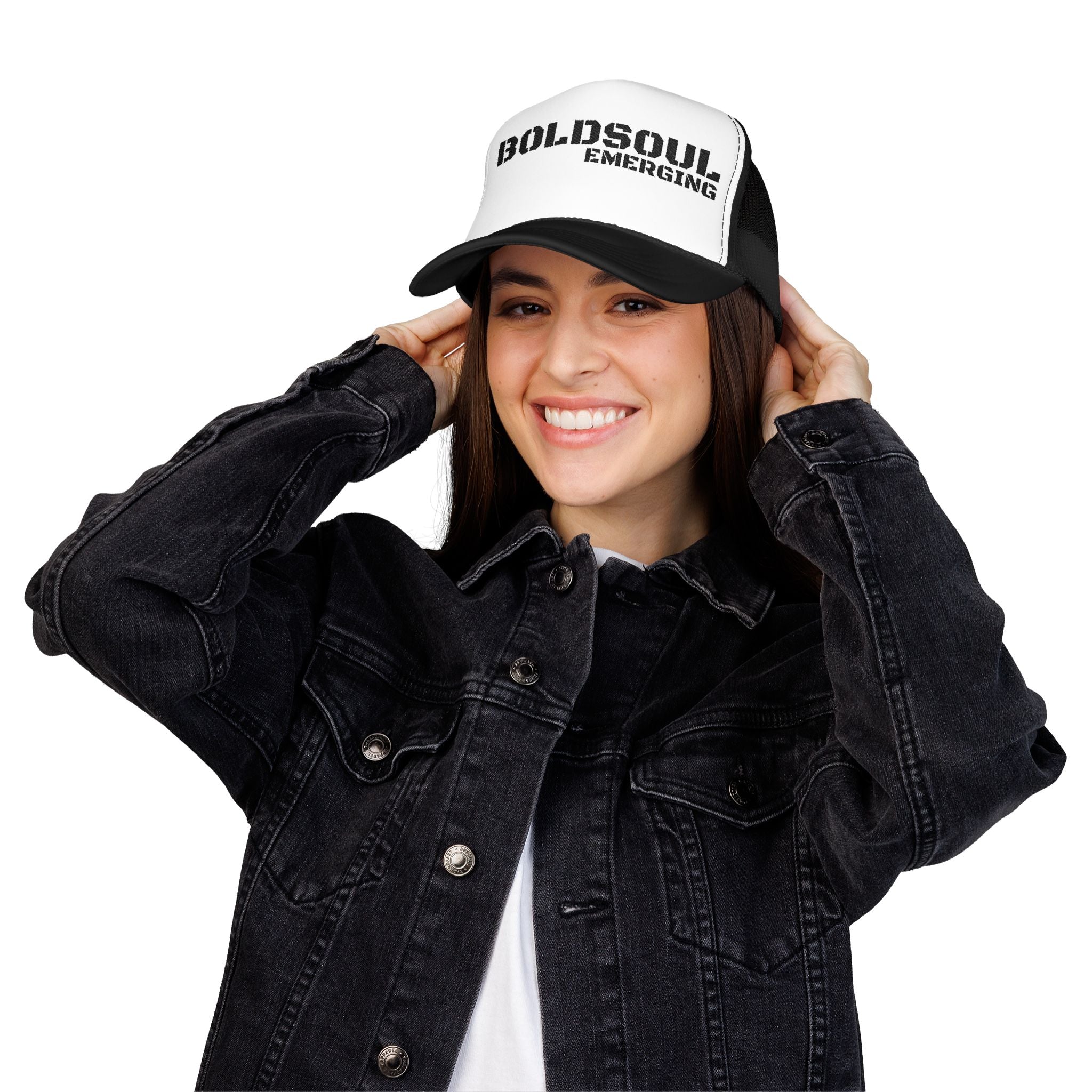 Model wearing BOLDSOUL foam trucker hat in white and hot pink with black text graphic, mesh back, and curved brim
